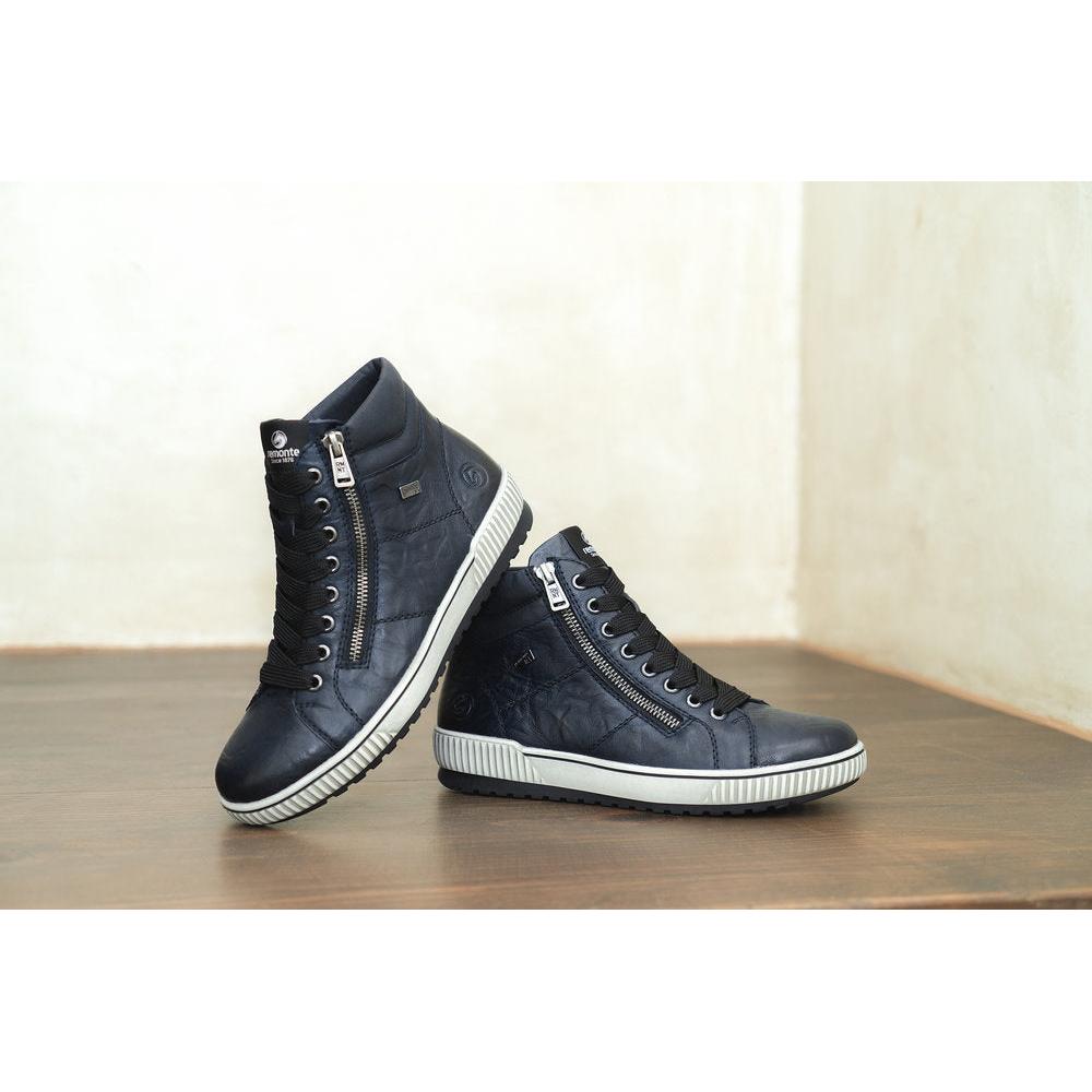 Remonte D0772-15 women's navy leather ankle boots with water resistance, zip and lace-up closure, and white rubber soles.