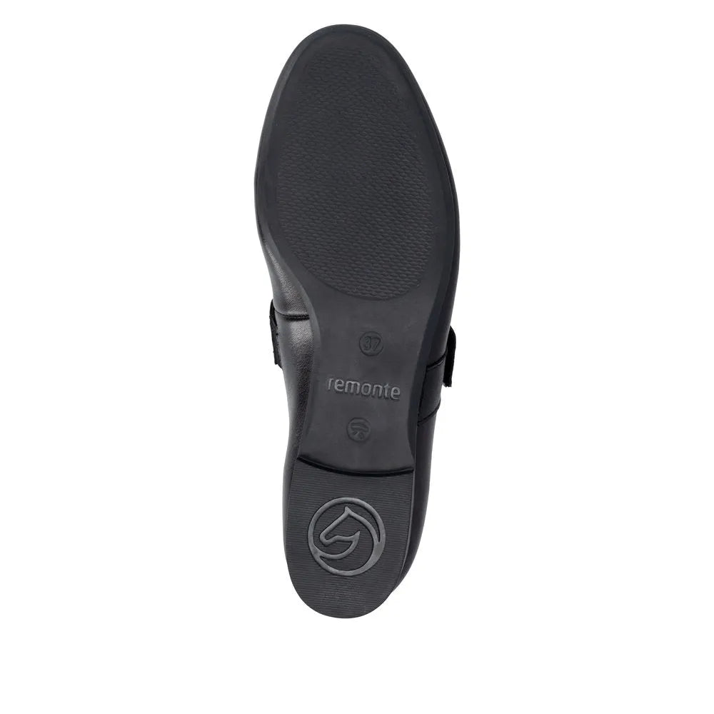 Black leather ladies' touch-fastening shoes with a textured sole and silver logo detail on the heel.