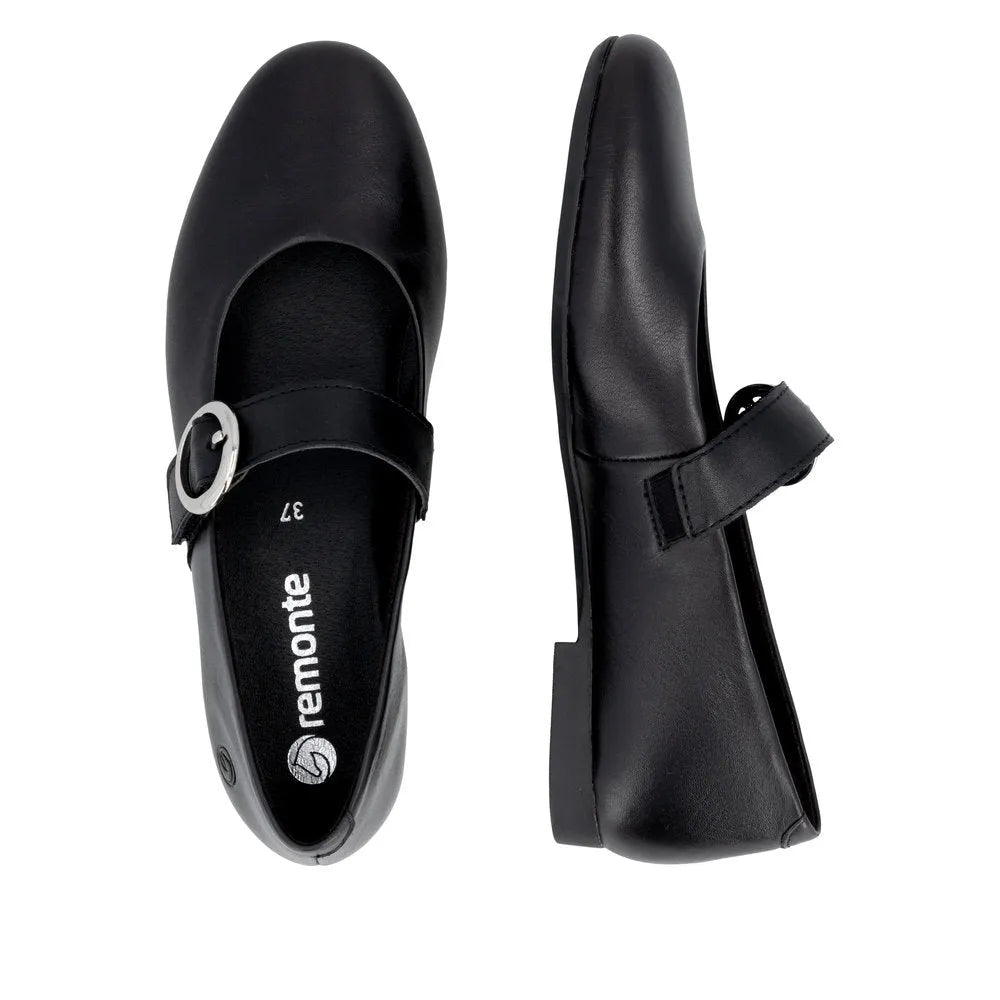 Black leather ladies touch-fastening shoes with a rounded toe and silver buckle detail.