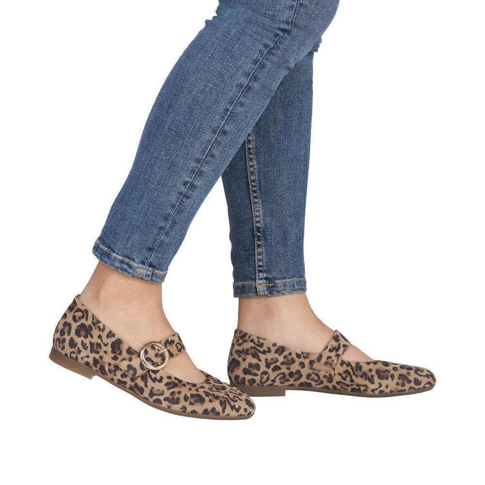 Leopard print suede shoes with a touch fastening strap, flat sole, styled with blue jeans.