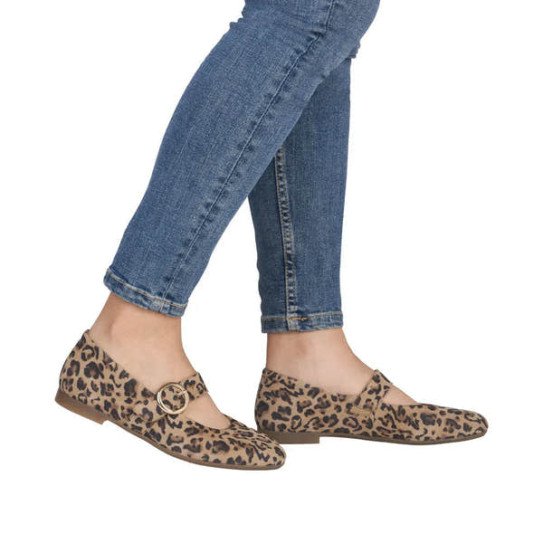Leopard print suede shoes with a touch fastening strap, flat sole, styled with blue jeans.