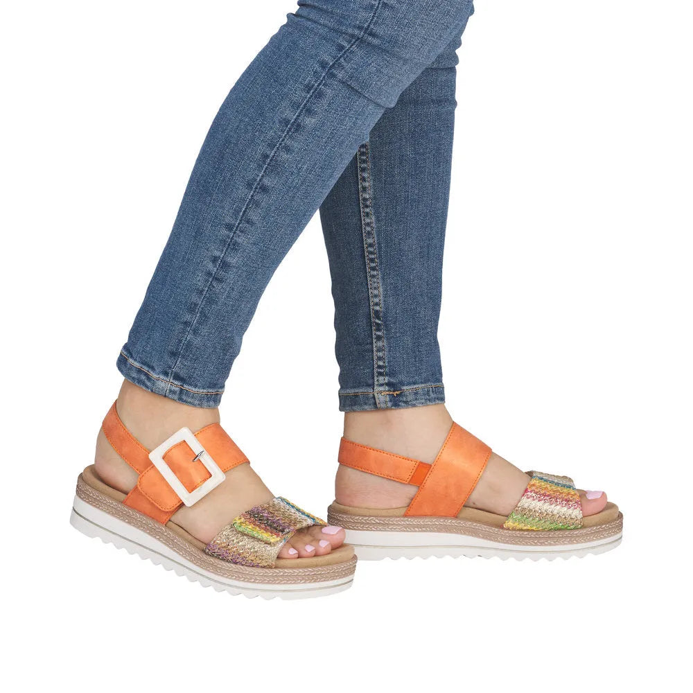 Remonte ladies orange and gold touch fastening sandals with multicolored straps and chunky white soles.