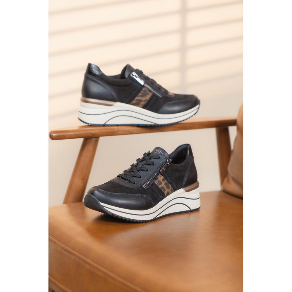 Remonte D0T09-04 women's wide-fit black vegan sneakers with zip and lace-up design, leopard print accents, and thick wedge sole.