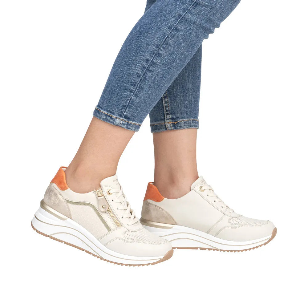 Remonte D0T10-80 women's wide-fit trainers with multi-zip and lace design, featuring beige, white, and orange accents.