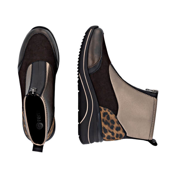 Remonte women's wide-fitting ankle boots with metallic vegan leather, front zipper, and leopard print detail.