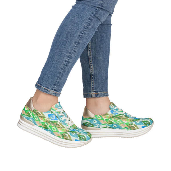 Women's green multi lace-up shoes with floral pattern, metallic accents, and white chunky soles.
