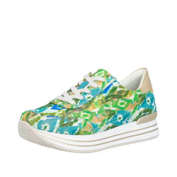 Green multi-patterned lace-up sneaker with white sole and beige heel detail, made of textile material.