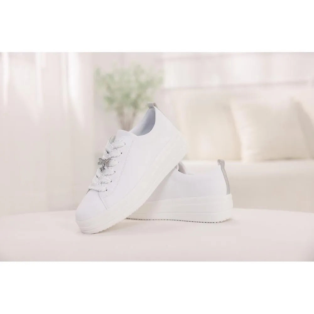 White leather lace-up shoes with chunky soles and bow-detail laces for women.