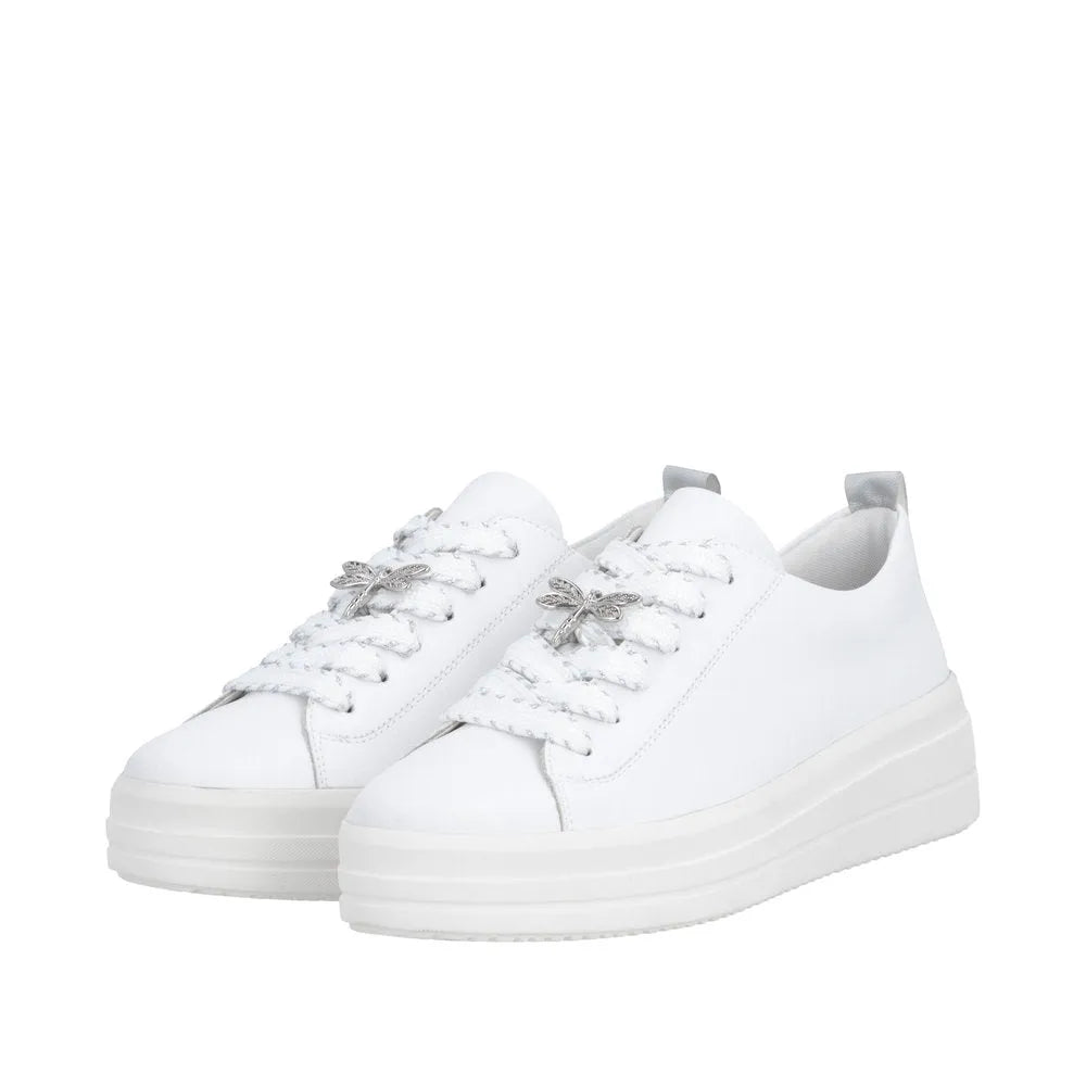 White leather lace-up shoes with chunky soles, silver dragonfly embellishments on laces, and pull tabs at the back.