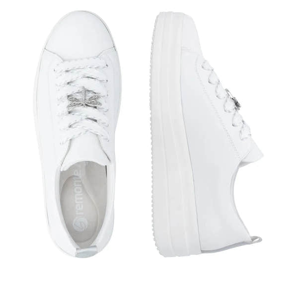 White leather lace-up shoes for women with a chunky sole and silver decorative details on the laces.