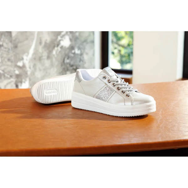 Off-white vegan sneakers with silver accents, lace-up style, cushioned platform sole, and elasticated detail.