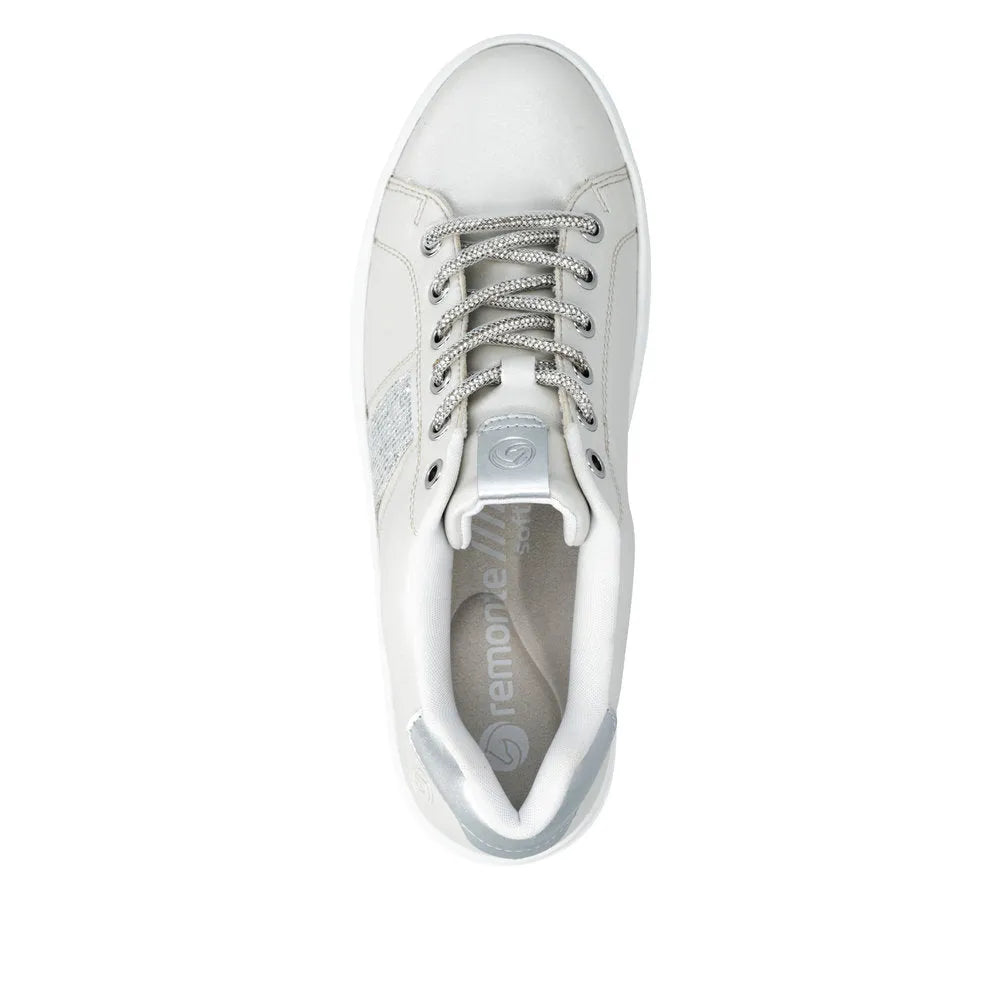 Off-white and silver vegan elasticated women's sneakers with laces, rounded toe, and cushioned collar.