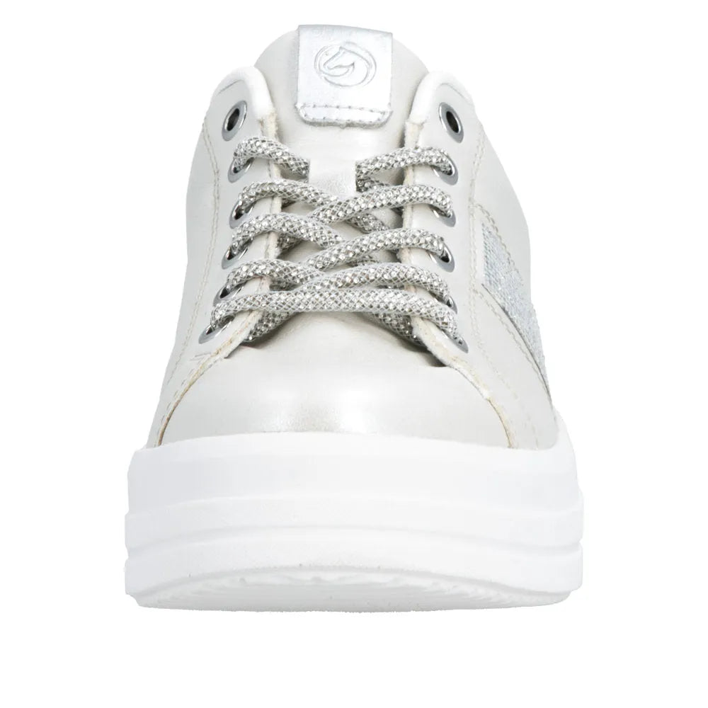 Off-white vegan elasticated ladies' sneakers with silver accents, thick sole, lace-up closure, and silver textured shoelaces.