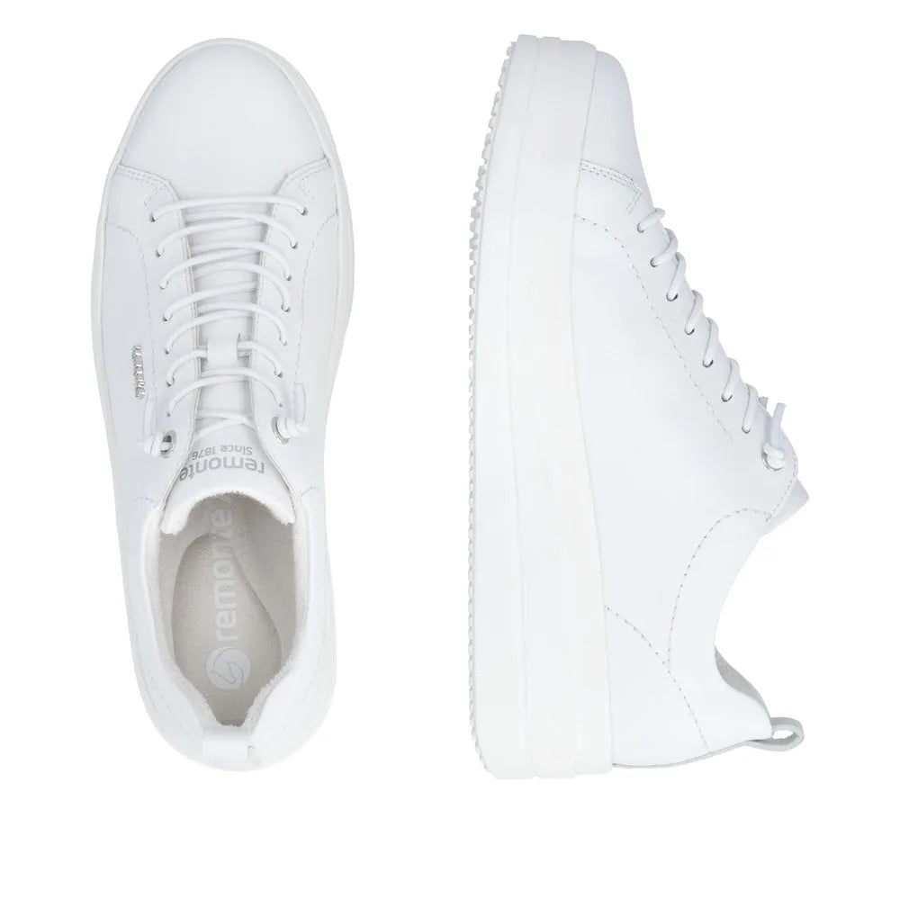 White leather lace-up sneakers with a chunky sole and minimal design for women.