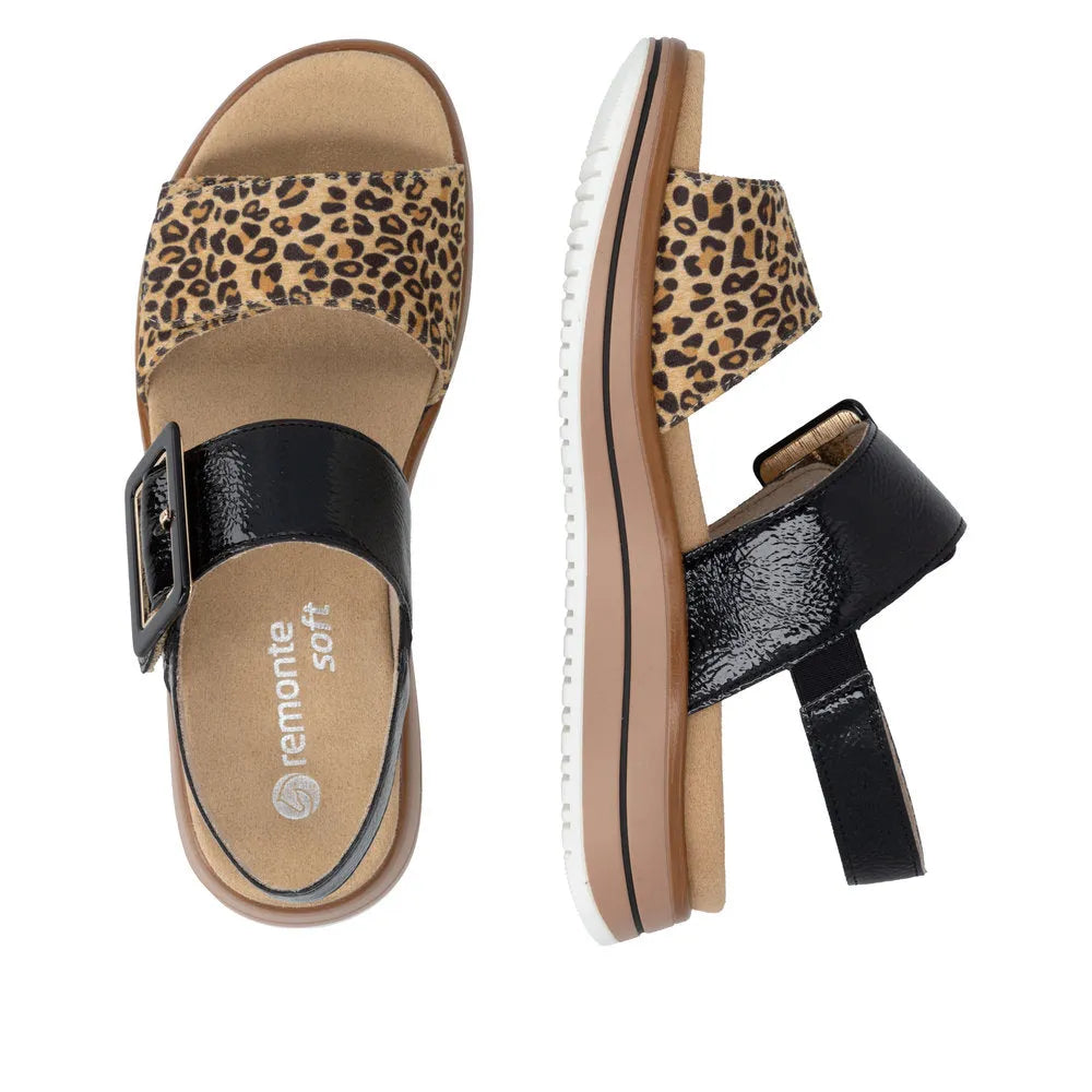 Ladies black and animal print leather touch fastening sandals with buckle strap, comfort sole, and chunky sole design.