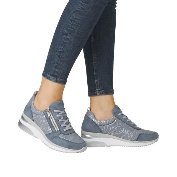 Ladies blue textile and suede sneakers with side zipper, laces, silver accents, and a white sole.