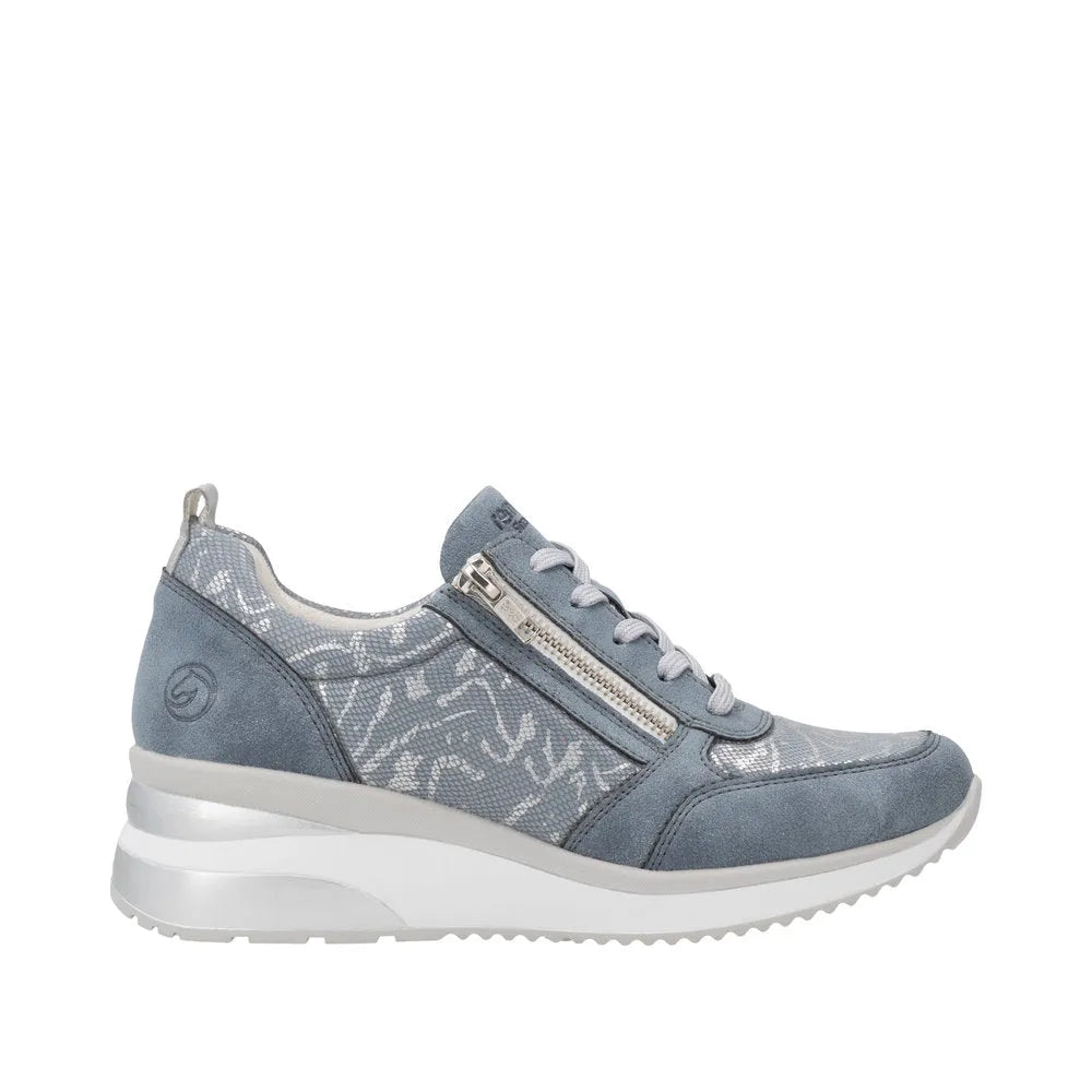 Blue textile sneaker with side zipper, lace-up front, mixed materials, and a white chunky sole.