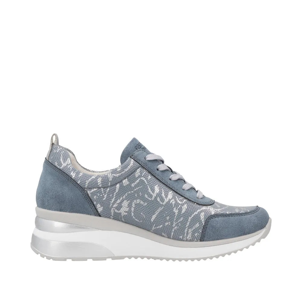 Blue textile ladies' sneakers with side zipper, lace-up, white sole, and patterned accents.