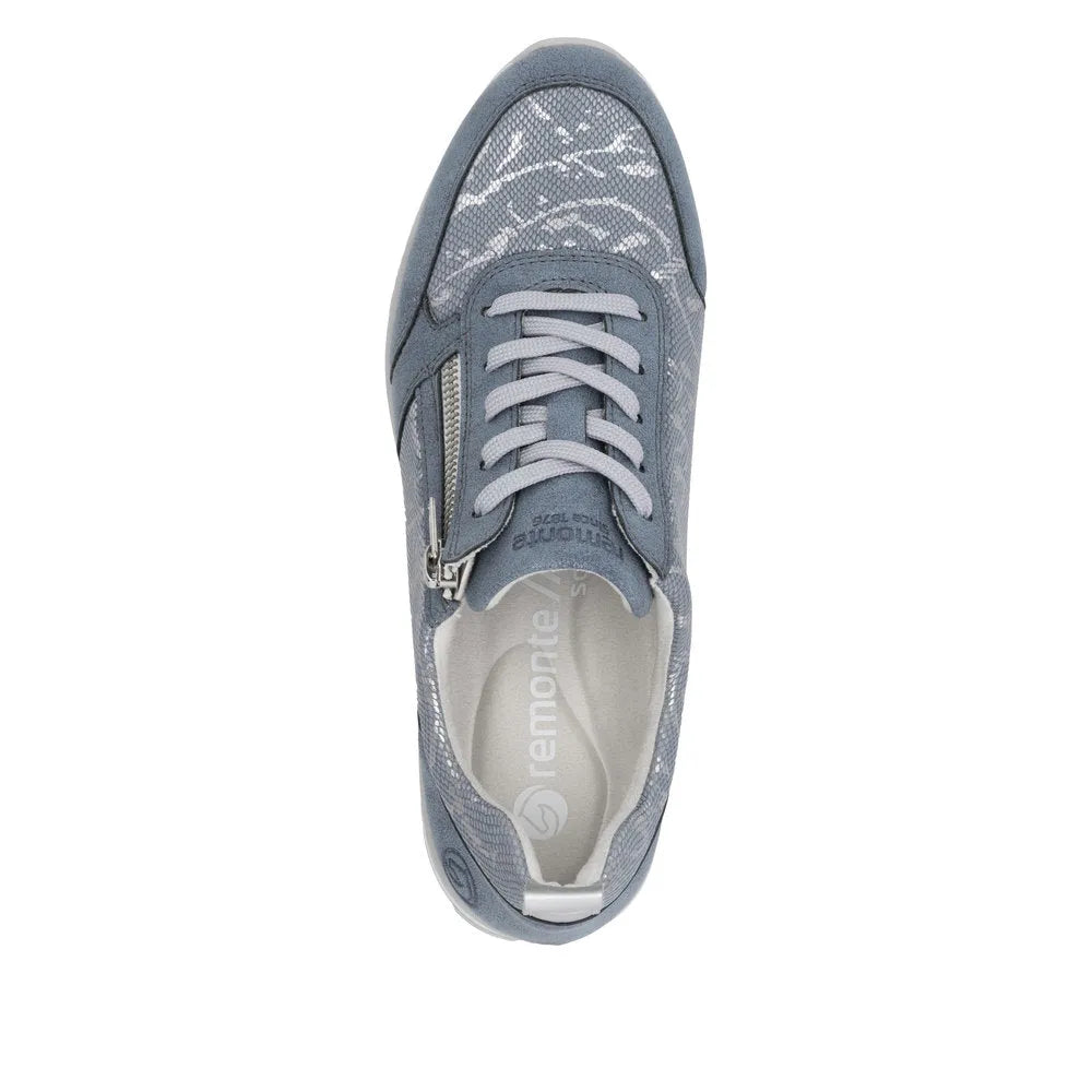 Blue textile women's sneaker with side zipper, lace-up front, padded collar, and textured details.
