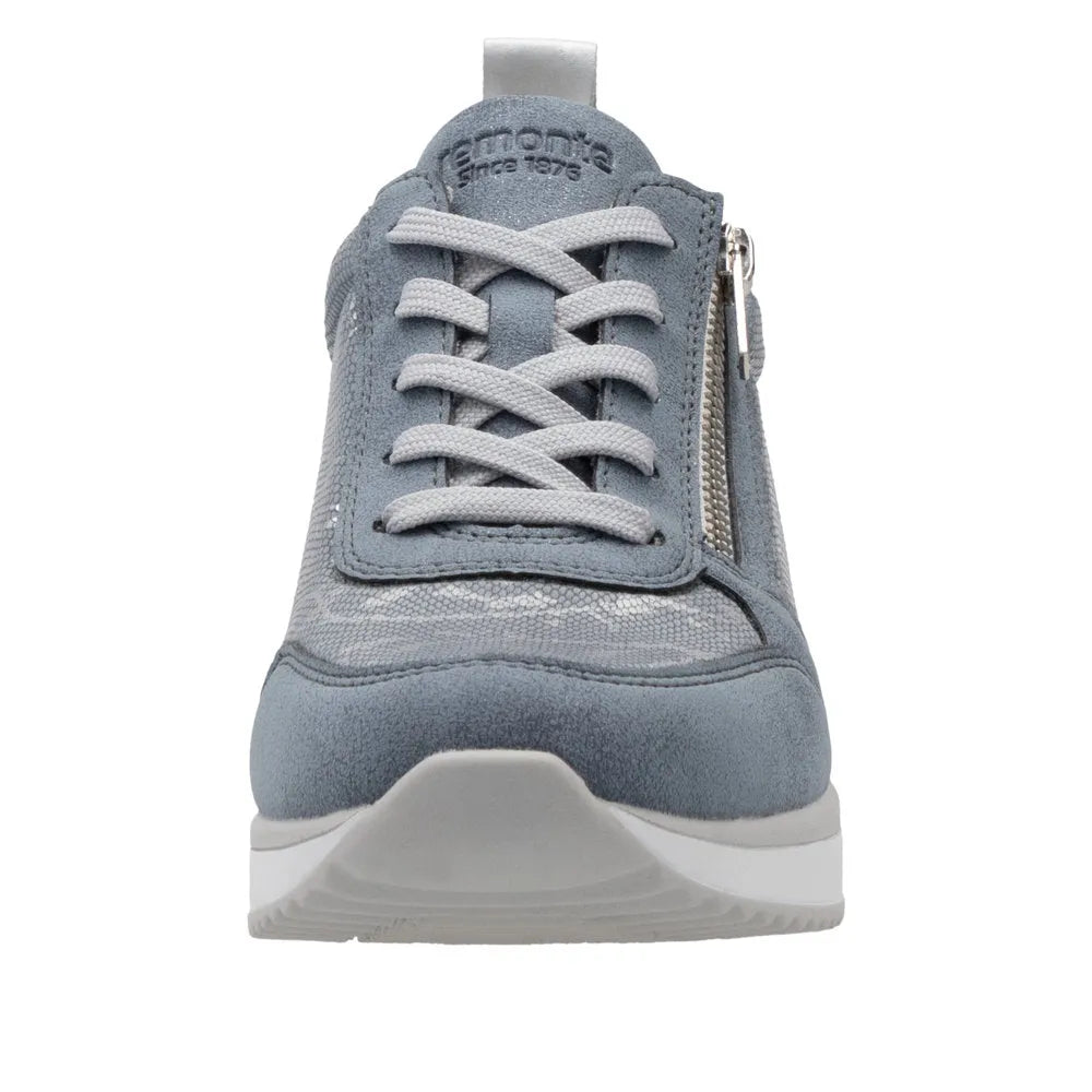 Blue textile women's sneaker with side zipper, lace-up front, and sporty design.