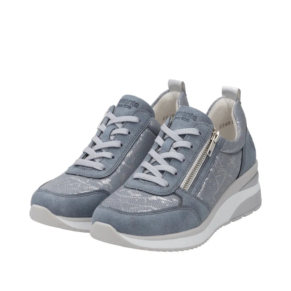 Blue textile wedge sneakers with side zipper, laces, and textured accents.