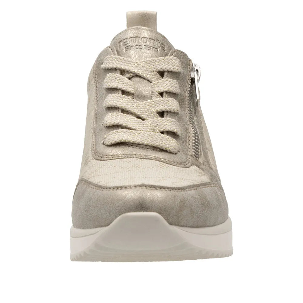Cream textile ladies' slip-on sneakers with side zipper, lace-up front, textured material, and white sole.