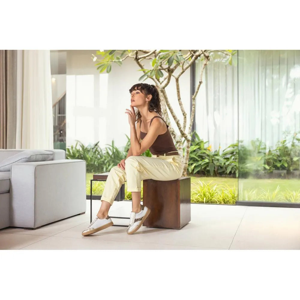 Ladies' wide white and leopard lace-up trainers featuring a stylish design, lightweight materials, and a comfortable fit.