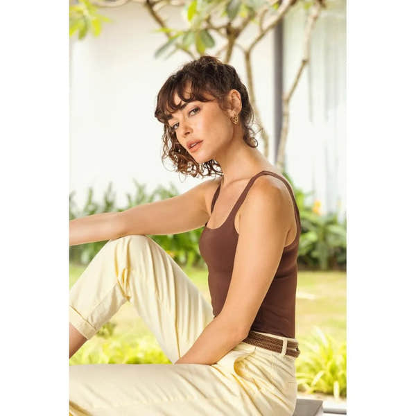 Ladies' white and leopard-pattern lace-up trainers featuring a wide fit and lightweight design for comfort and style.