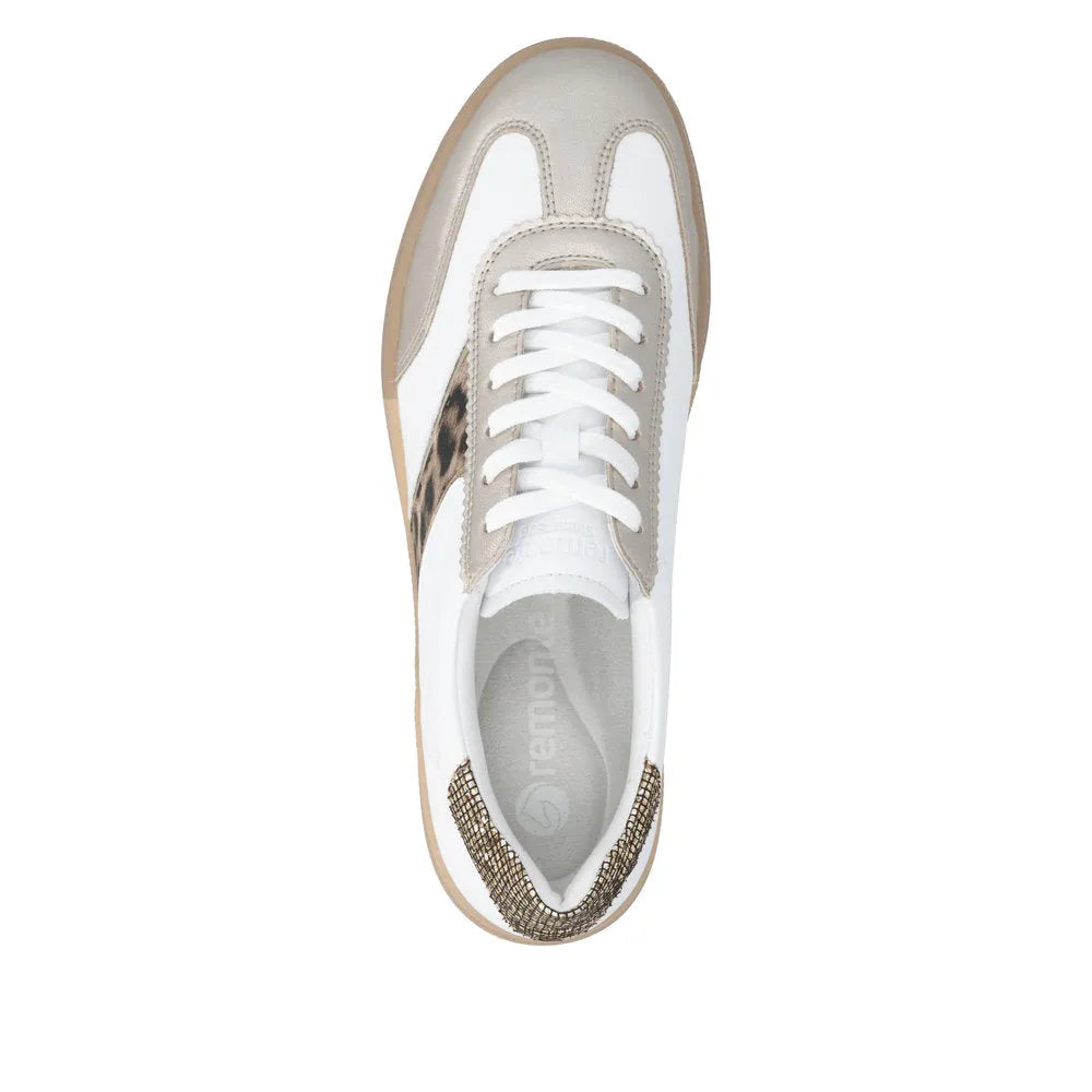 White lace-up trainers with leopard print and taupe accents; features a textured sole and cushioned insole for comfort.