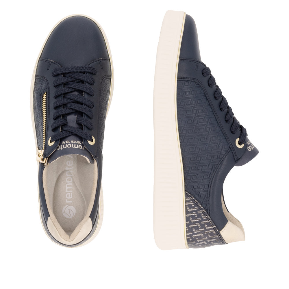Remonte D2E00-14 women's wide-fit navy leather zip and lace sneakers with a white sole and textured detailing.