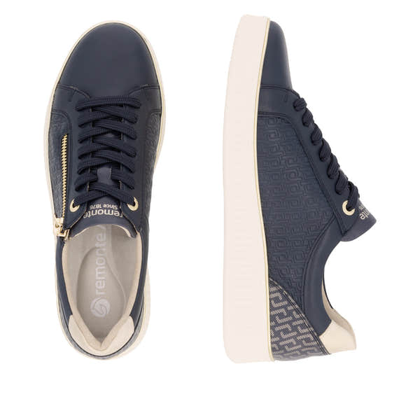 Remonte D2E00-14 women's wide-fit navy leather zip and lace sneakers with a white sole and textured detailing.