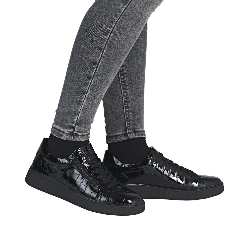 Remonte D2E01-00 women's black patent lace-up sneakers with side zipper, chunky sole, and wide fit, suitable for casual wear.