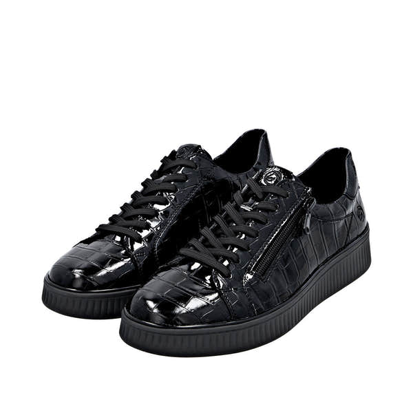 Black patent leather women's sneakers with side zippers, lace-up closure, and chunky rubber soles.