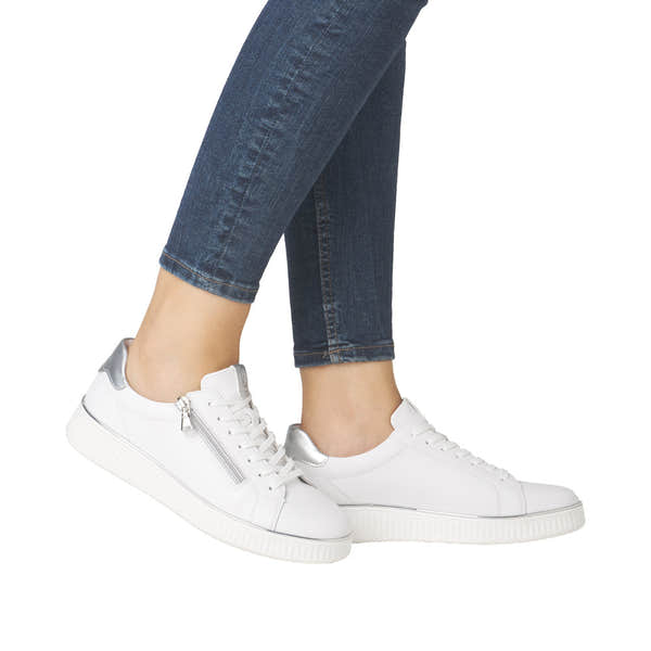 Remonte D2E01-80 women's white leather trainers with silver accents, zip and lace-up closure, chunky sole, and wide fit.