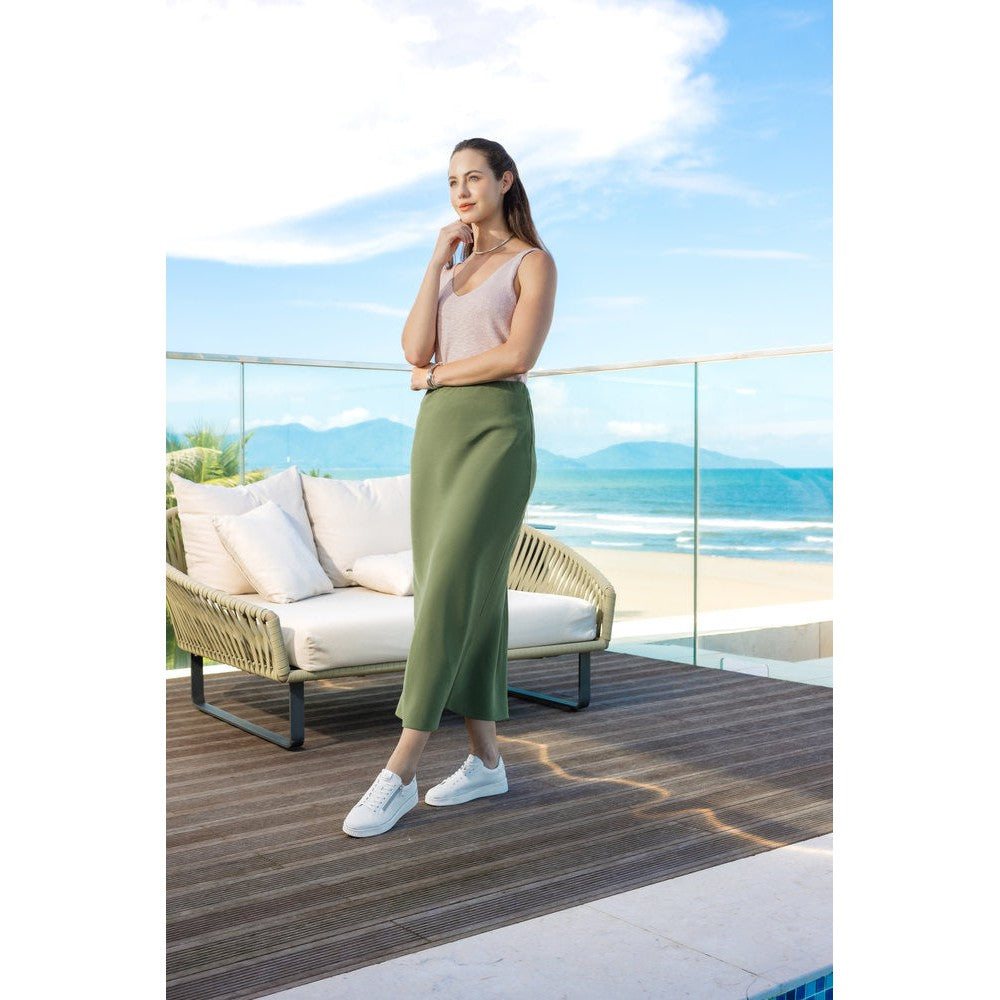Remonte D2E01-80 women's white leather trainers with zip and lace, wide fit, casual style, on a patio overlooking the beach.