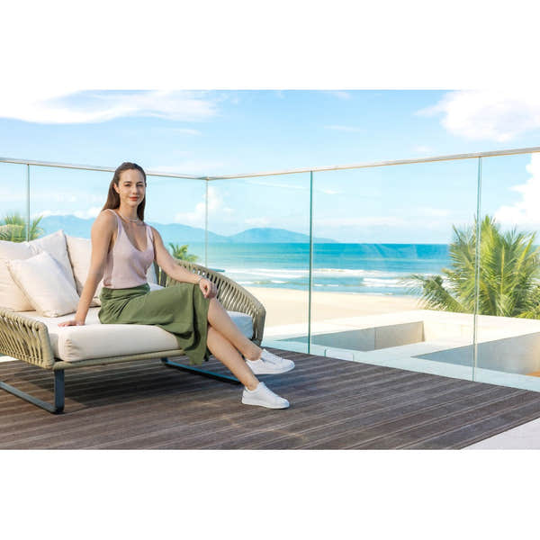 Remonte D2E01-80 women's wide white leather trainers with zip and lace, stylish casual footwear on a balcony overlooking the beach.