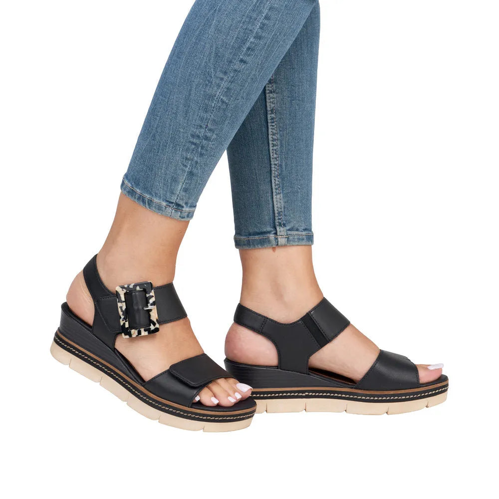 Remonte D2L53-00 women's black leather touch fastening sandals with chunky sole and animal-print buckle detail.