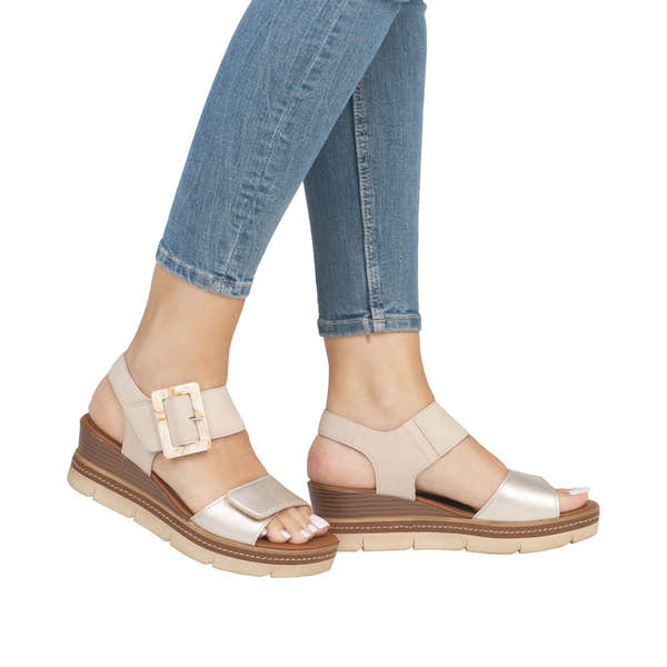 Remonte D2L53-60 women's pale gold leather touch fastening sandals with chunky wedge sole and wide straps.