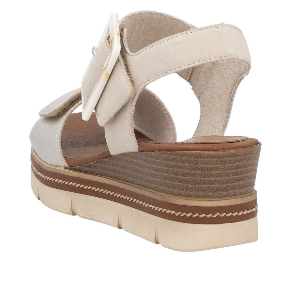 Remonte D2L53-60 ladies pale gold leather sandals with touch fastening straps and layered platform sole.