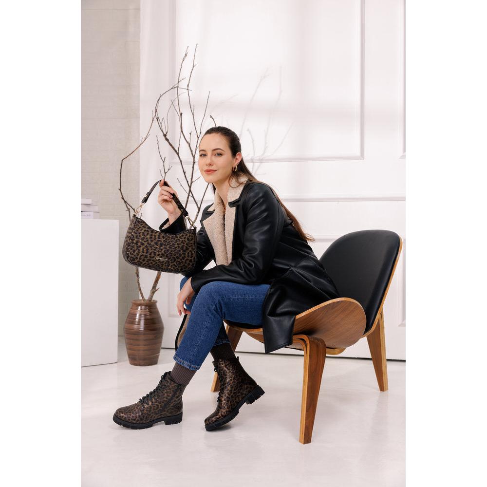 Remonte D2S72-90 women's wide fit animal print vegan ankle boots with zip and lace-up design, paired with jeans and a leather jacket.