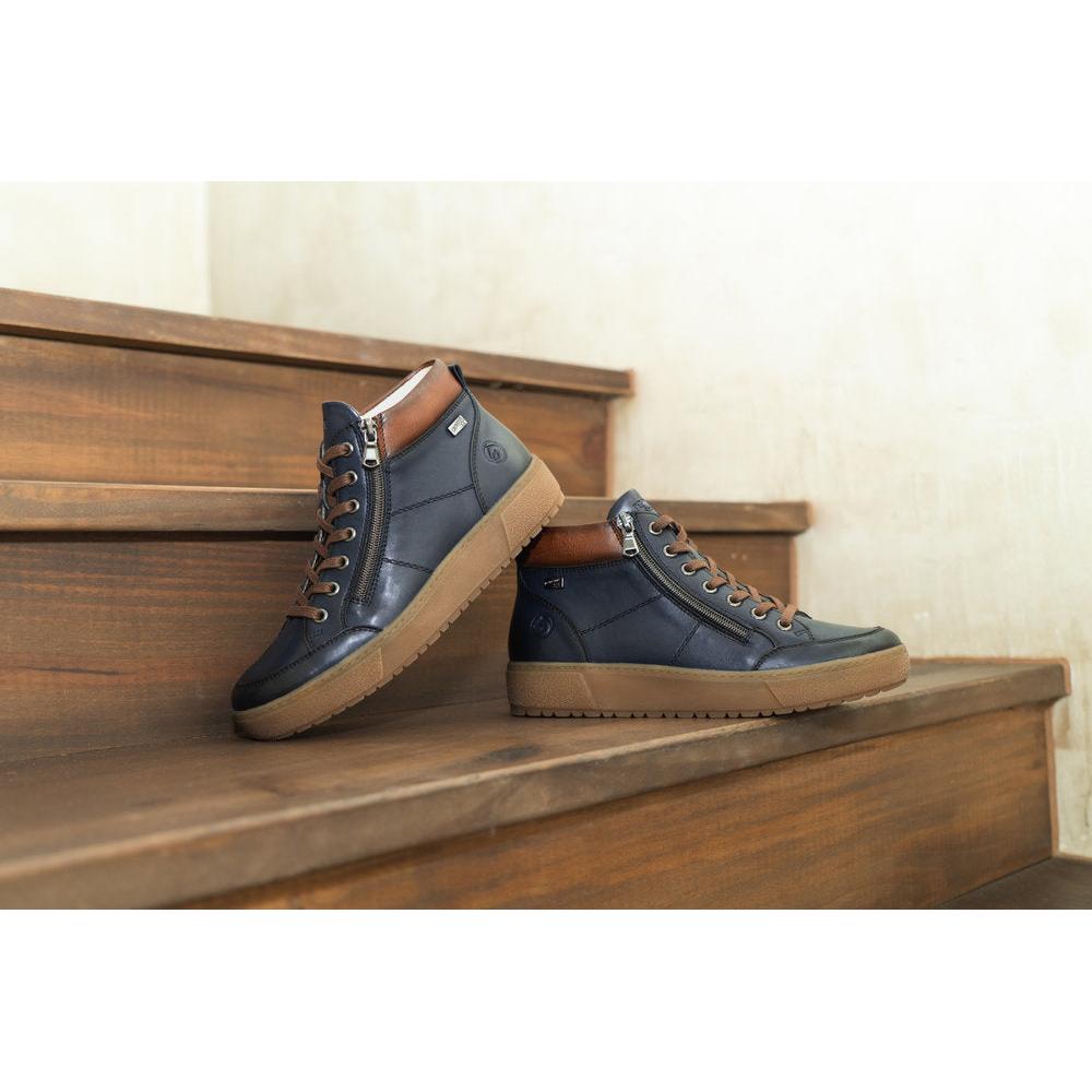 Remonte D2T70-14 women's navy water-resistant ankle boots with zippers, lace-up front, and tan rubber soles.