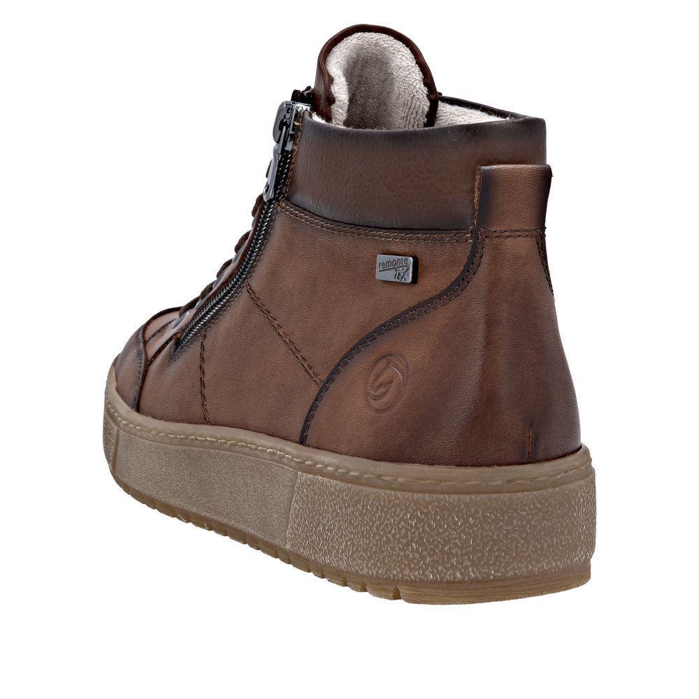 Remonte D2T70-24 women's wide brown leather water-resistant ankle boots with zipper and lace, featuring a cushioned sole and cozy interior lining.