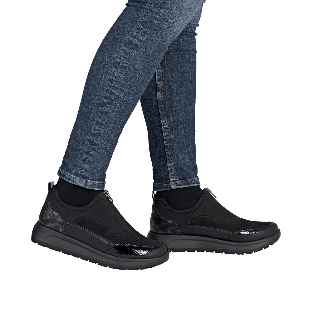 Remonte D2V01-04 women's wide black vegan textile shoes with front zip and stylish design, paired with denim jeans.