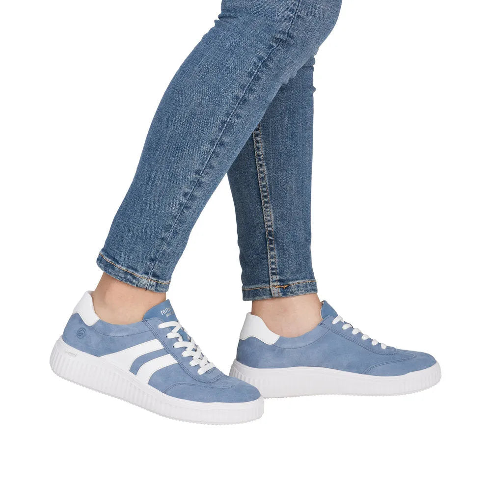 Ladies wide blue suede lace-up shoes with white accents and a chunky white sole.