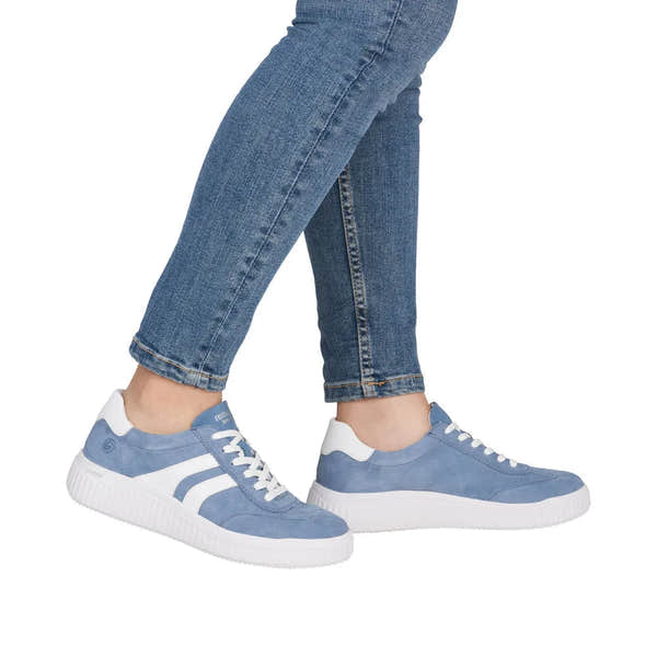 Ladies wide blue suede lace-up shoes with white accents and a chunky white sole.