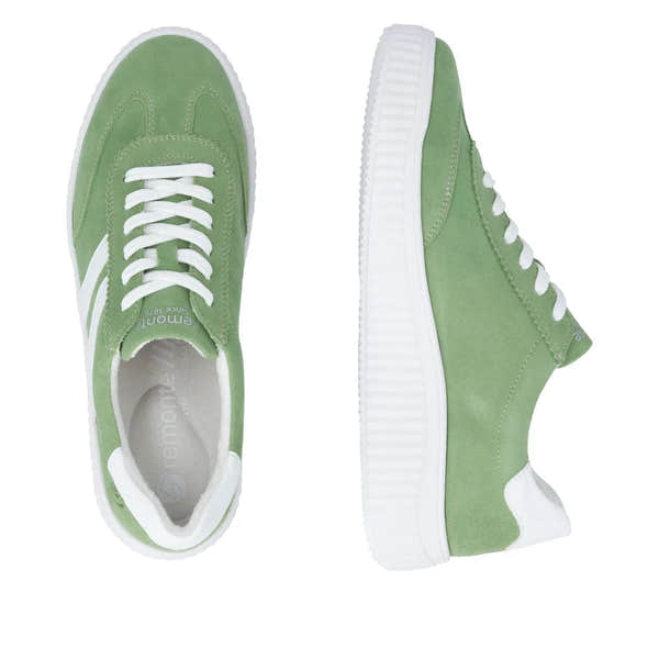 Green suede lace-up shoes with white accents and chunky soles for women.