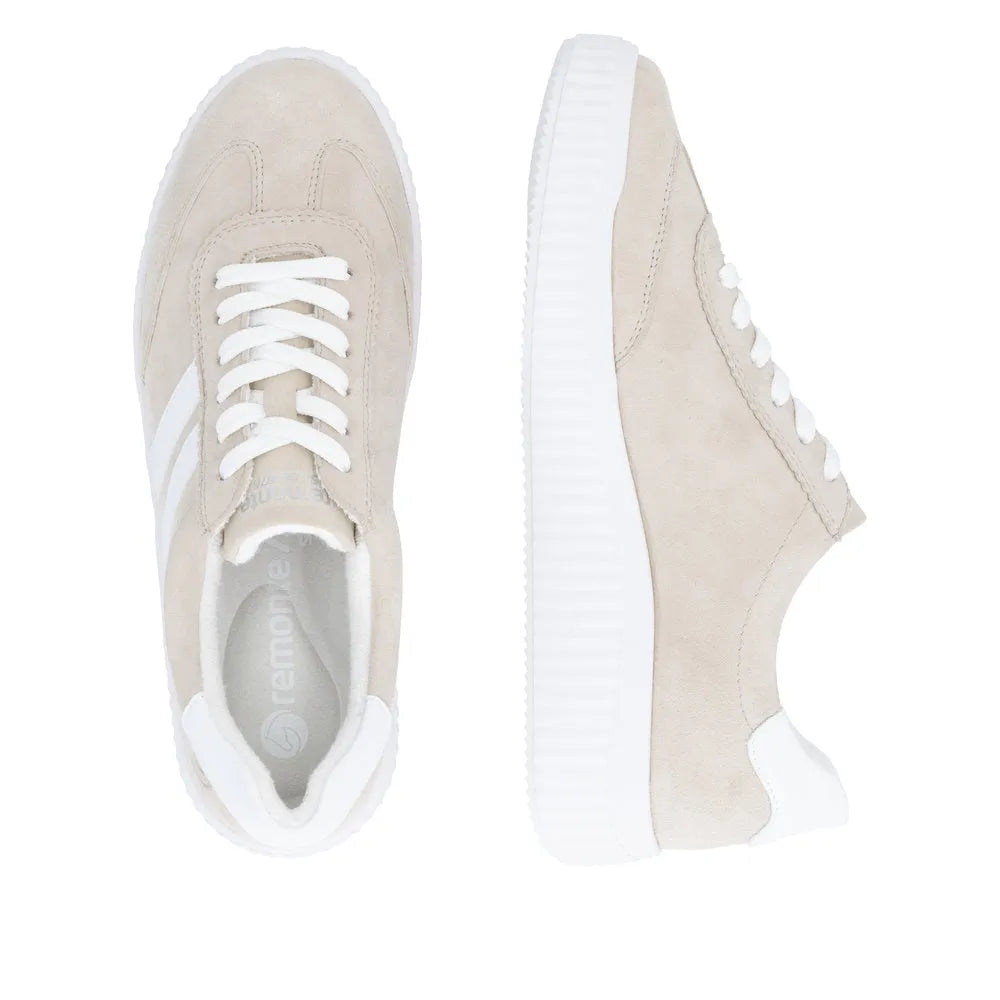 Beige suede lace-up shoes with white accents, wide fit, and chunky white sole for women.