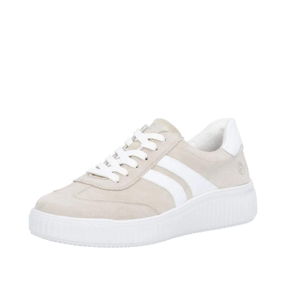 Beige suede lace-up sneaker with white accents, chunky sole, and wide-fit design for women.
