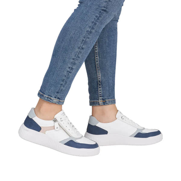 Women's white, blue, and beige wide-fit leather and fabric zip and lace sneakers with chunky soles.