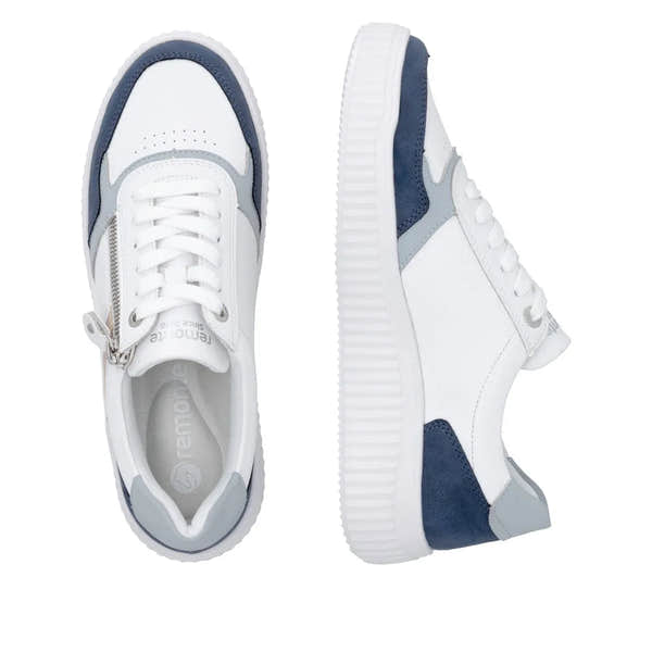 White and navy leather women's sneakers with lace-up and zipper detail, chunky white sole, and wide fit.